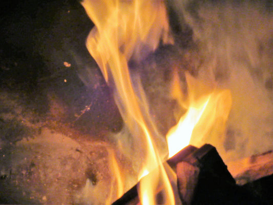 Outdoor South African braai with fire and meat on the grill